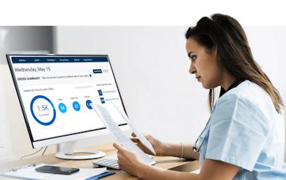 nurse on computer reviewing documents nurse on computer reviewing documents